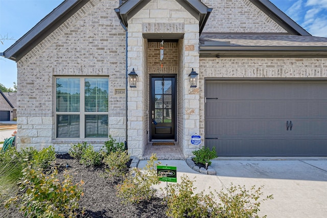 doorway to property featuring a garage