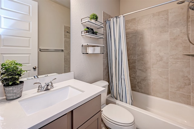 full bathroom featuring shower / tub combo, large vanity, and toilet