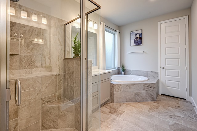 bathroom featuring shower with separate bathtub, tile floors, and vanity