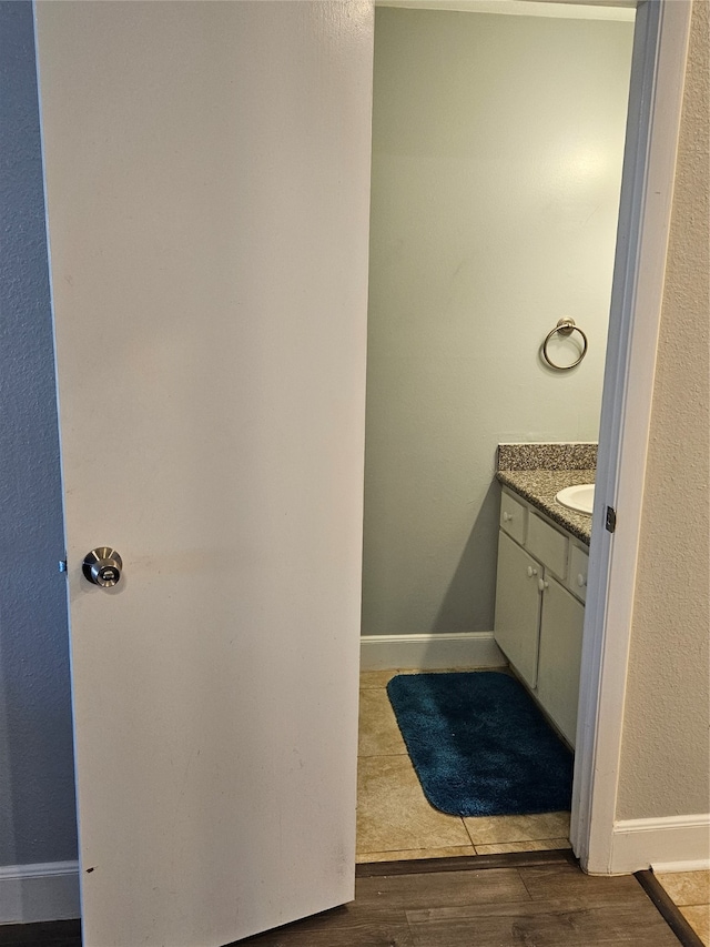 bathroom featuring wood-type flooring and vanity