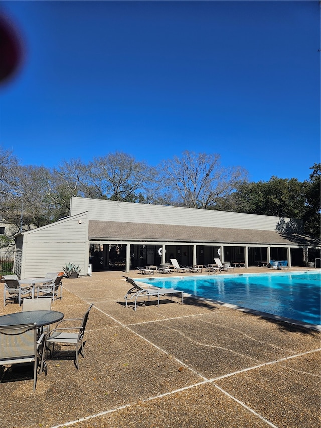 view of swimming pool with a patio