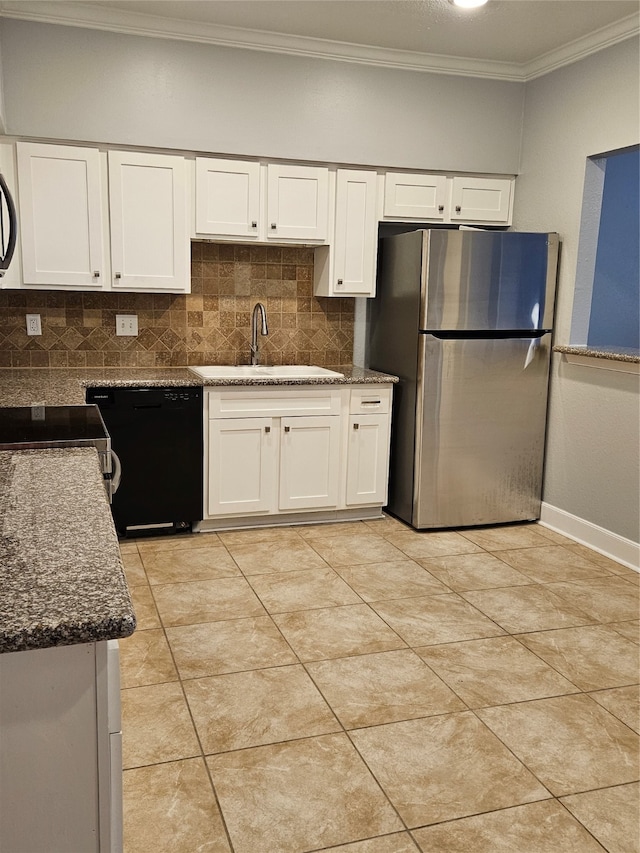 kitchen featuring black dishwasher, tasteful backsplash, white cabinets, and stainless steel refrigerator