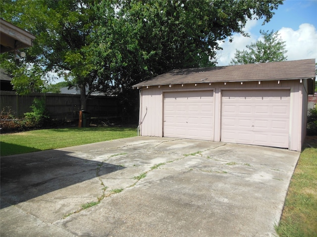 garage with a yard