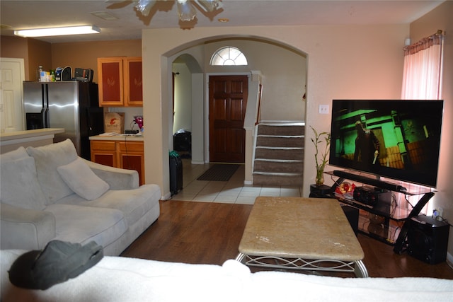 living room with hardwood / wood-style floors and ceiling fan