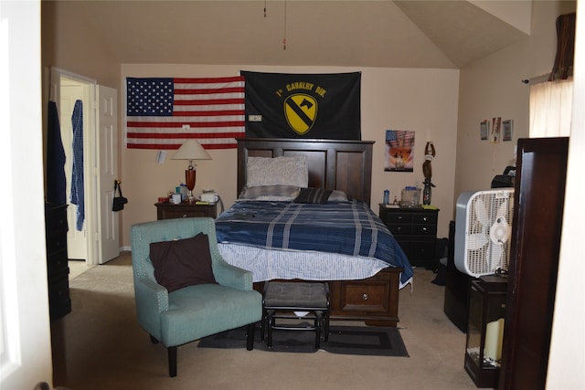 bedroom featuring light carpet and lofted ceiling