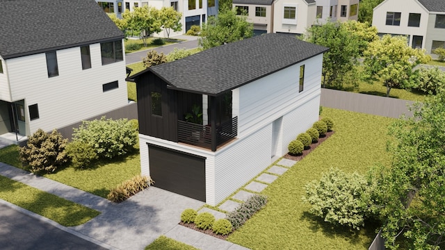 view of front of home featuring a front yard and a garage