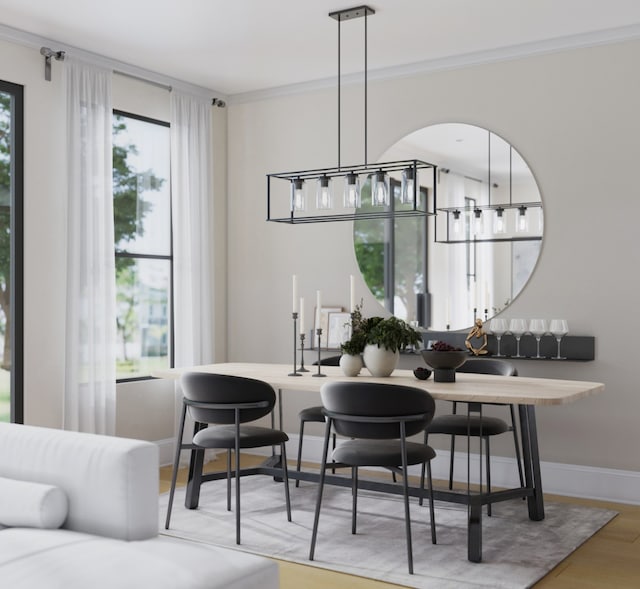 dining space with a notable chandelier, plenty of natural light, light hardwood / wood-style flooring, and crown molding