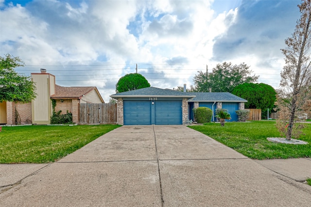 ranch-style house with a front lawn and a garage