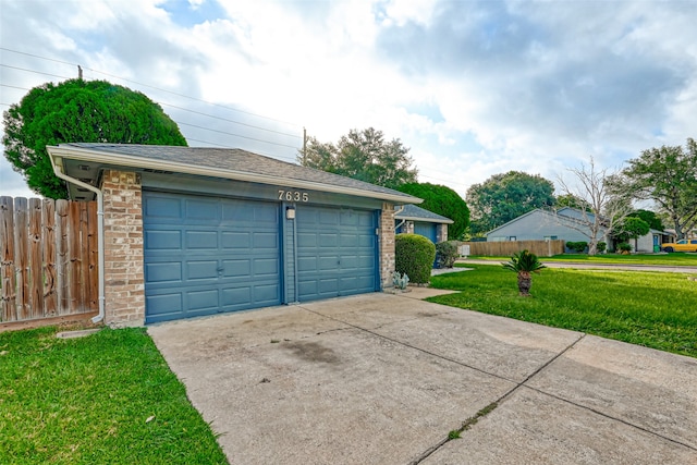 garage featuring a yard