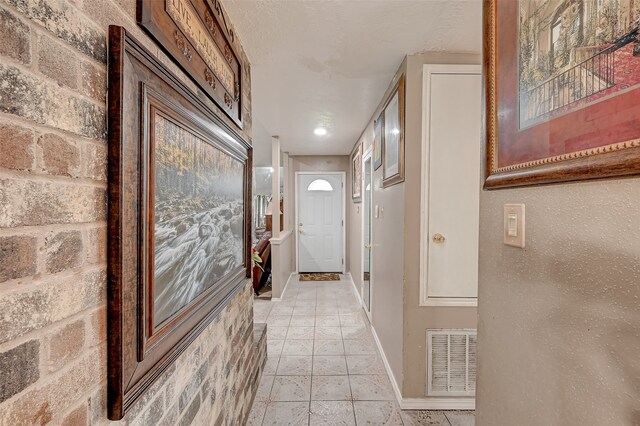 7635 Loro Linda Dr, Houston, TX 77083 - hall with light tile patterned floors, visible vents, and baseboards