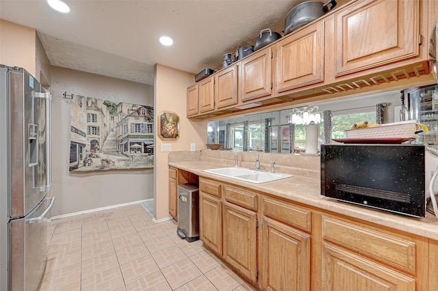 7635 Loro Linda Dr, Houston, TX 77083 - kitchen featuring a sink, recessed lighting, stainless steel fridge, light countertops, and baseboards
