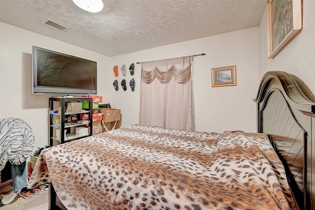 7635 Loro Linda Dr, Houston, TX 77083 - carpeted bedroom featuring visible vents and a textured ceiling