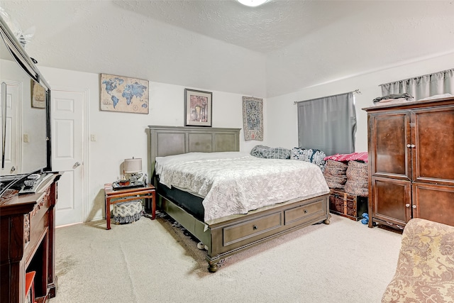 7635 Loro Linda Dr, Houston, TX 77083 - bedroom featuring vaulted ceiling, light colored carpet, and a textured ceiling