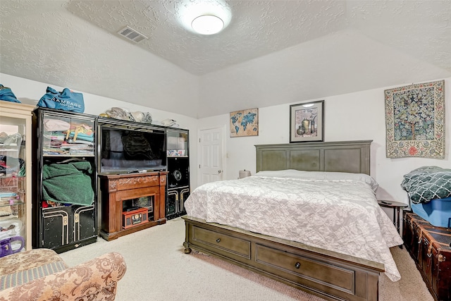7635 Loro Linda Dr, Houston, TX 77083 - bedroom featuring visible vents, a textured ceiling, carpet floors, and vaulted ceiling