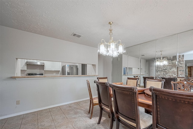 7635 Loro Linda Dr, Houston, TX 77083 - dining space with an inviting chandelier, baseboards, visible vents, and a textured ceiling