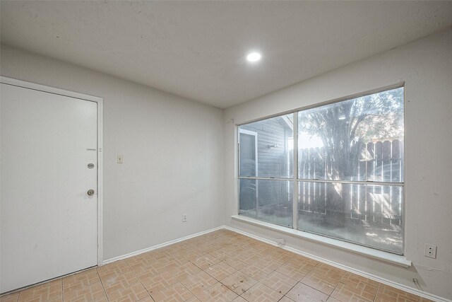7635 Loro Linda Dr, Houston, TX 77083 - spare room featuring brick floor, recessed lighting, and baseboards