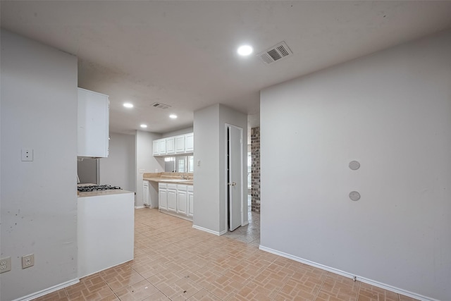 7635 Loro Linda Dr, Houston, TX 77083 - kitchen with recessed lighting, visible vents, white cabinets, and baseboards