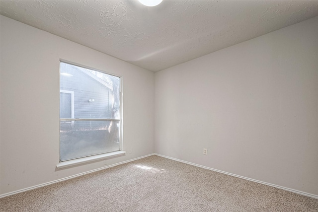 7635 Loro Linda Dr, Houston, TX 77083 - empty room with carpet flooring, baseboards, and a textured ceiling