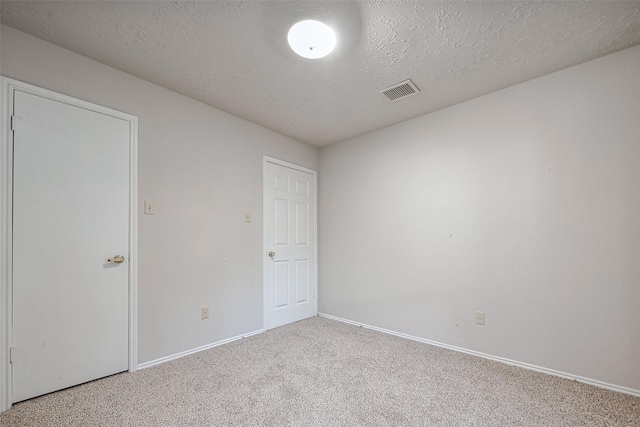 7635 Loro Linda Dr, Houston, TX 77083 - carpeted spare room with baseboards, visible vents, and a textured ceiling
