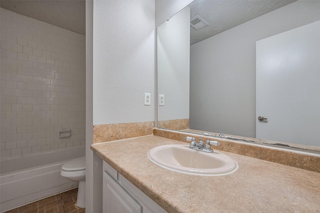 7635 Loro Linda Dr, Houston, TX 77083 - full bathroom featuring vanity, visible vents, tub / shower combination, a textured ceiling, and toilet