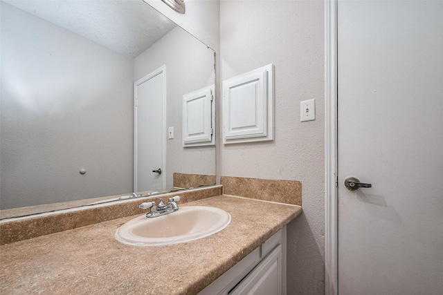 7635 Loro Linda Dr, Houston, TX 77083 - bathroom featuring vanity and a textured wall