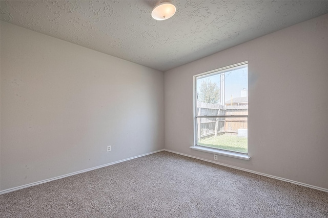 7635 Loro Linda Dr, Houston, TX 77083 - empty room featuring carpet flooring, a textured ceiling, and baseboards