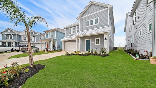 view of front of property featuring a front lawn and a garage