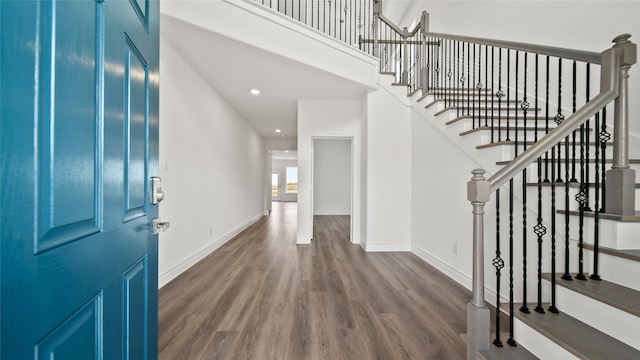 entryway with hardwood / wood-style floors