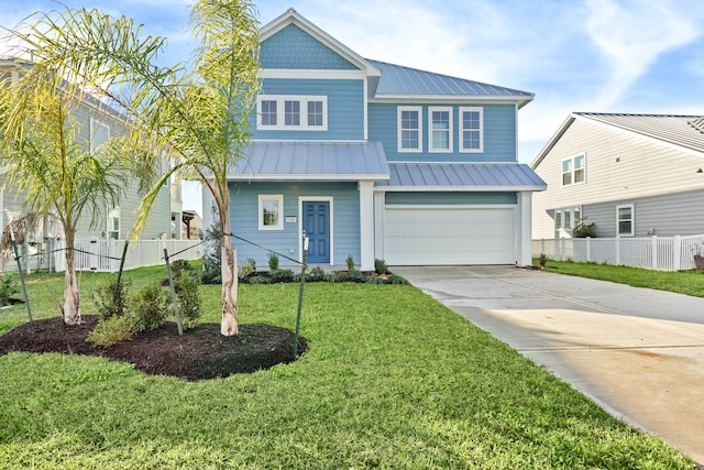 view of front of property with a front lawn and a garage