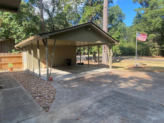 view of vehicle parking with a carport