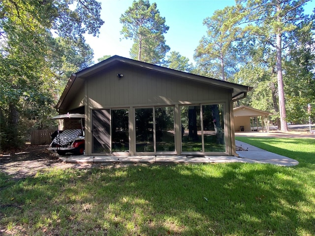 back of house featuring a yard