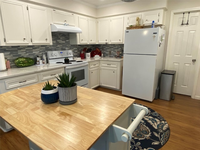 kitchen with hardwood / wood-style flooring, white cabinetry, white appliances, and tasteful backsplash