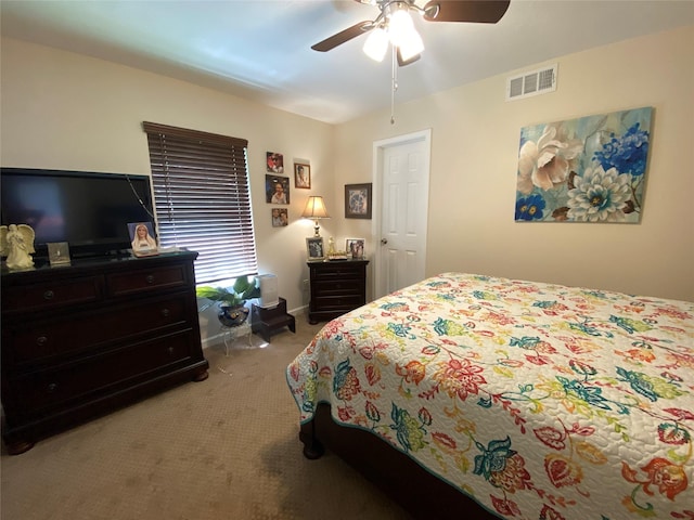 bedroom with light carpet and ceiling fan