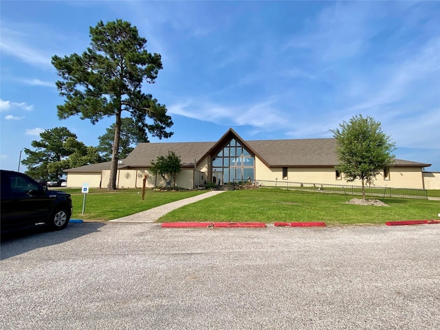 36 Corkwood Rd, Trinity, TX 75862 - view of front of home featuring uncovered parking, fence, and a front lawn
