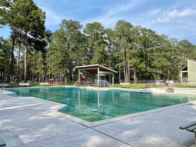 36 Corkwood Rd, Trinity, TX 75862 - pool featuring a patio, playground community, and fence