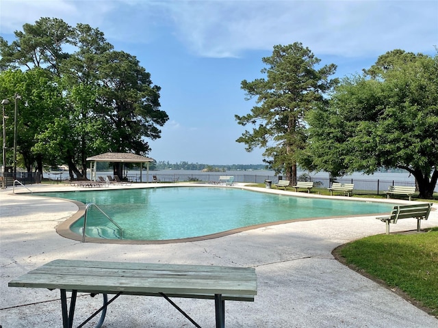 view of swimming pool with a patio area