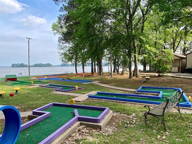 surrounding community featuring a water view