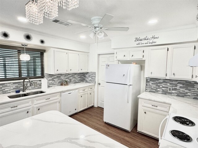 36 Corkwood Rd, Trinity, TX 75862 - kitchen with ceiling fan with notable chandelier, white appliances, white cabinetry, visible vents, and a sink