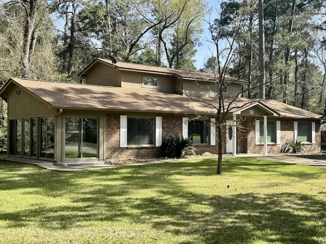 36 Corkwood Rd, Trinity, TX 75862 - view of front of house with brick siding and a front lawn