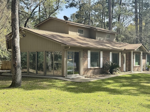 36 Corkwood Rd, Trinity, TX 75862 - view of front of home featuring a shingled roof and a front yard