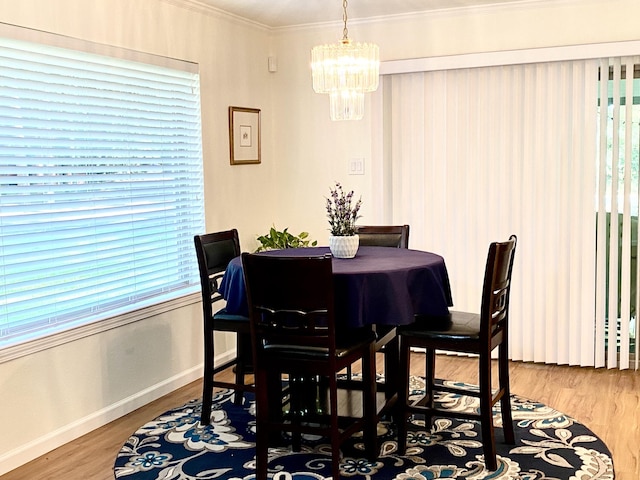 36 Corkwood Rd, Trinity, TX 75862 - dining room with baseboards, an inviting chandelier, ornamental molding, and wood finished floors