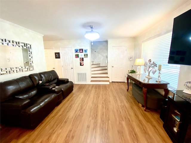36 Corkwood Rd, Trinity, TX 75862 - living area featuring stairway, visible vents, light wood-type flooring, and crown molding