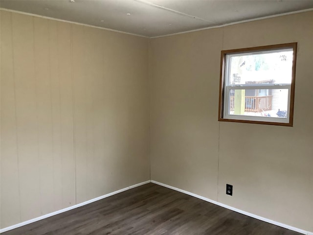 empty room featuring dark wood-type flooring