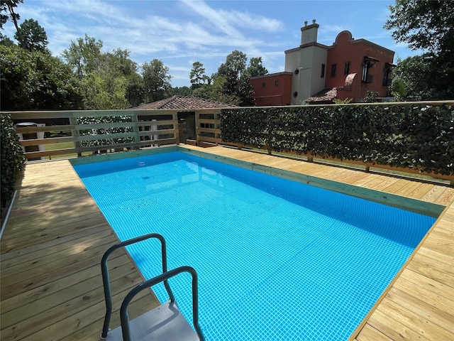 view of pool featuring a wooden deck