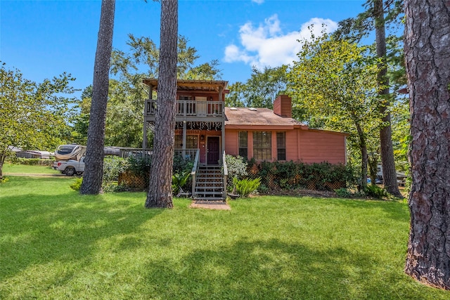 view of front of home with a front yard