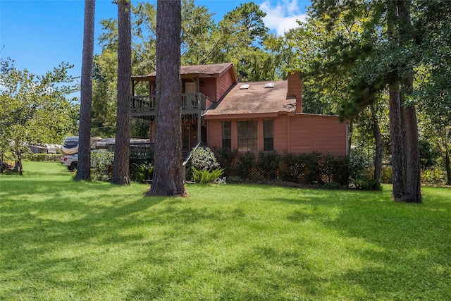 view of home's exterior with a lawn