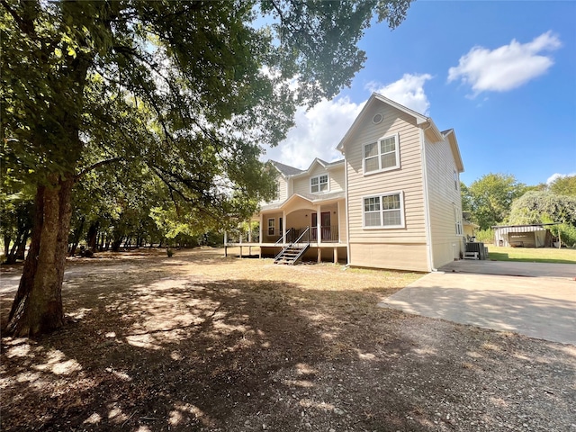 rear view of property with a porch