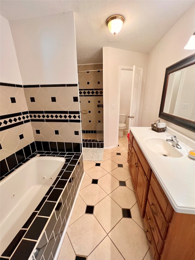 bathroom with tiled bath, tile floors, toilet, and vanity