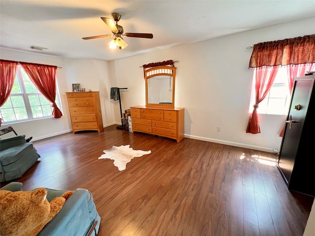 interior space featuring ceiling fan and dark hardwood / wood-style floors