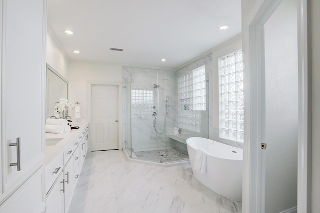 bathroom featuring vanity and separate shower and tub